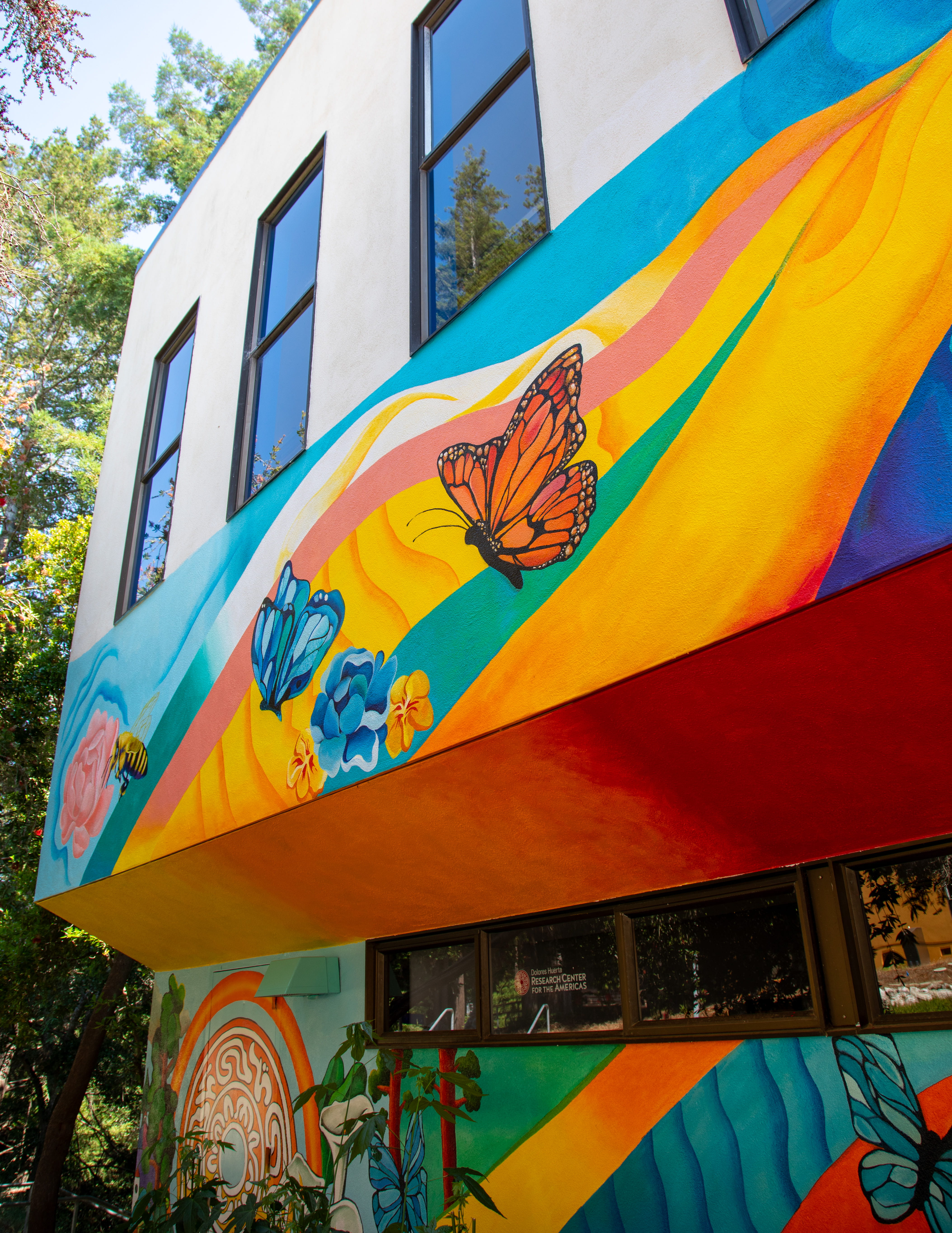 mural on casa latina, where the lab is housed with butterflies in bright oranges and blues